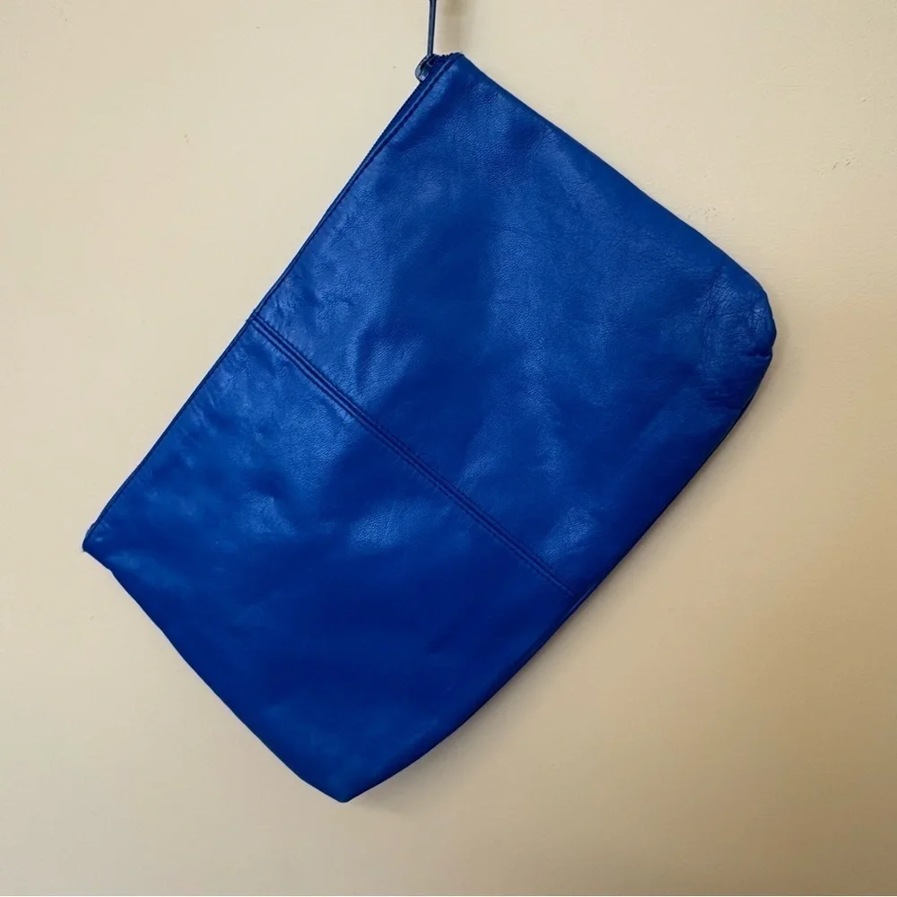Vintage Toni blue genuine leather wristlet with bow.